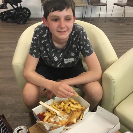 Ethan enjoying fish and chips