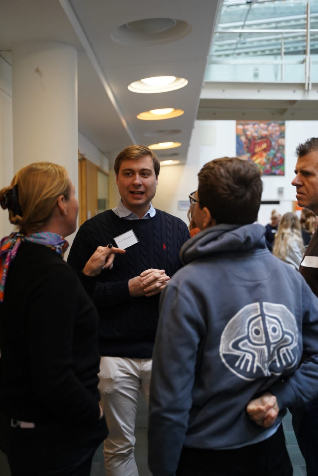 Guests and researchers chatting