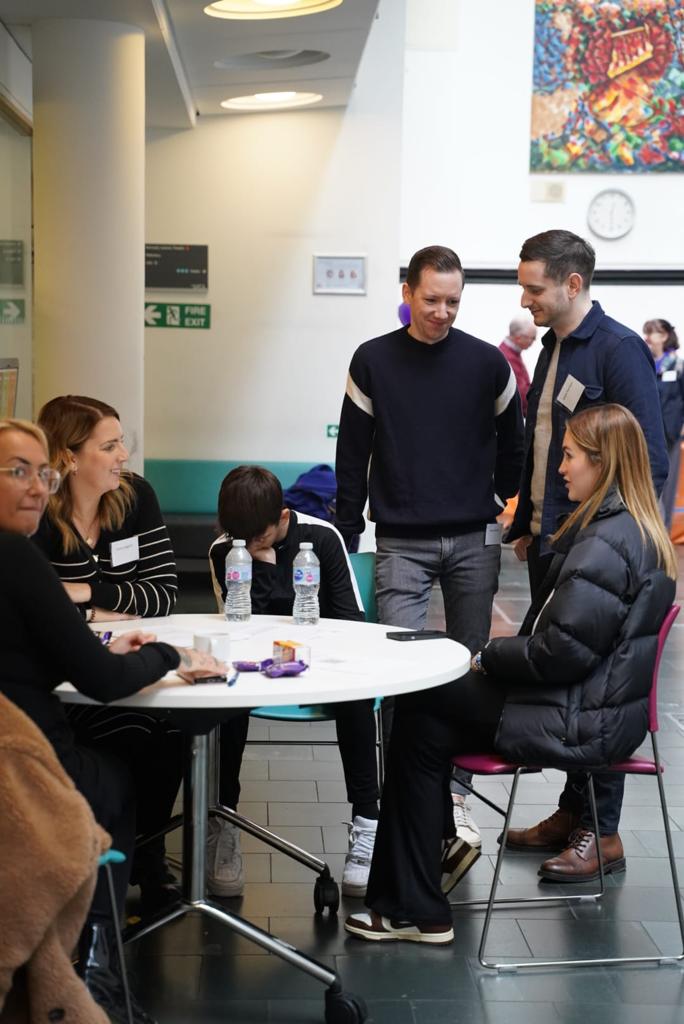 Guests chatting round a table