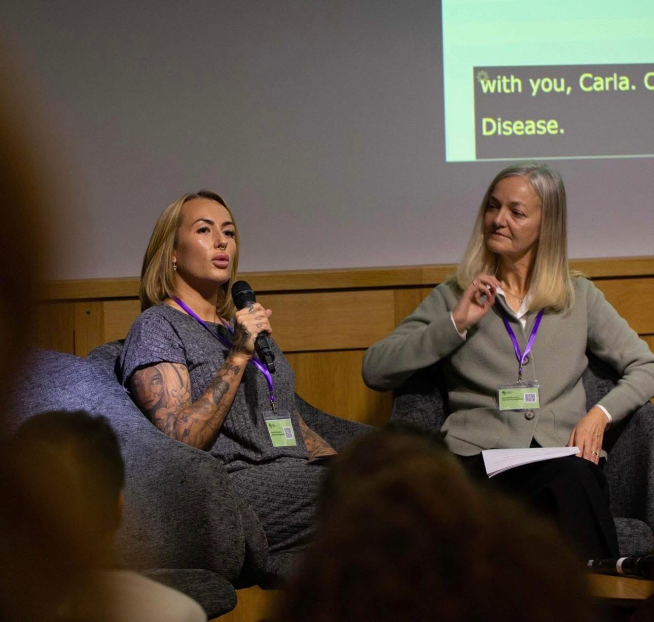 Carla Golledge & Prof Jane Sowden speaking on stage